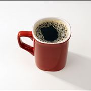 Picture Of Red Ceramic Coffee Mug With Black Coffee